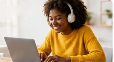 Student with headphones learning on a laptop
